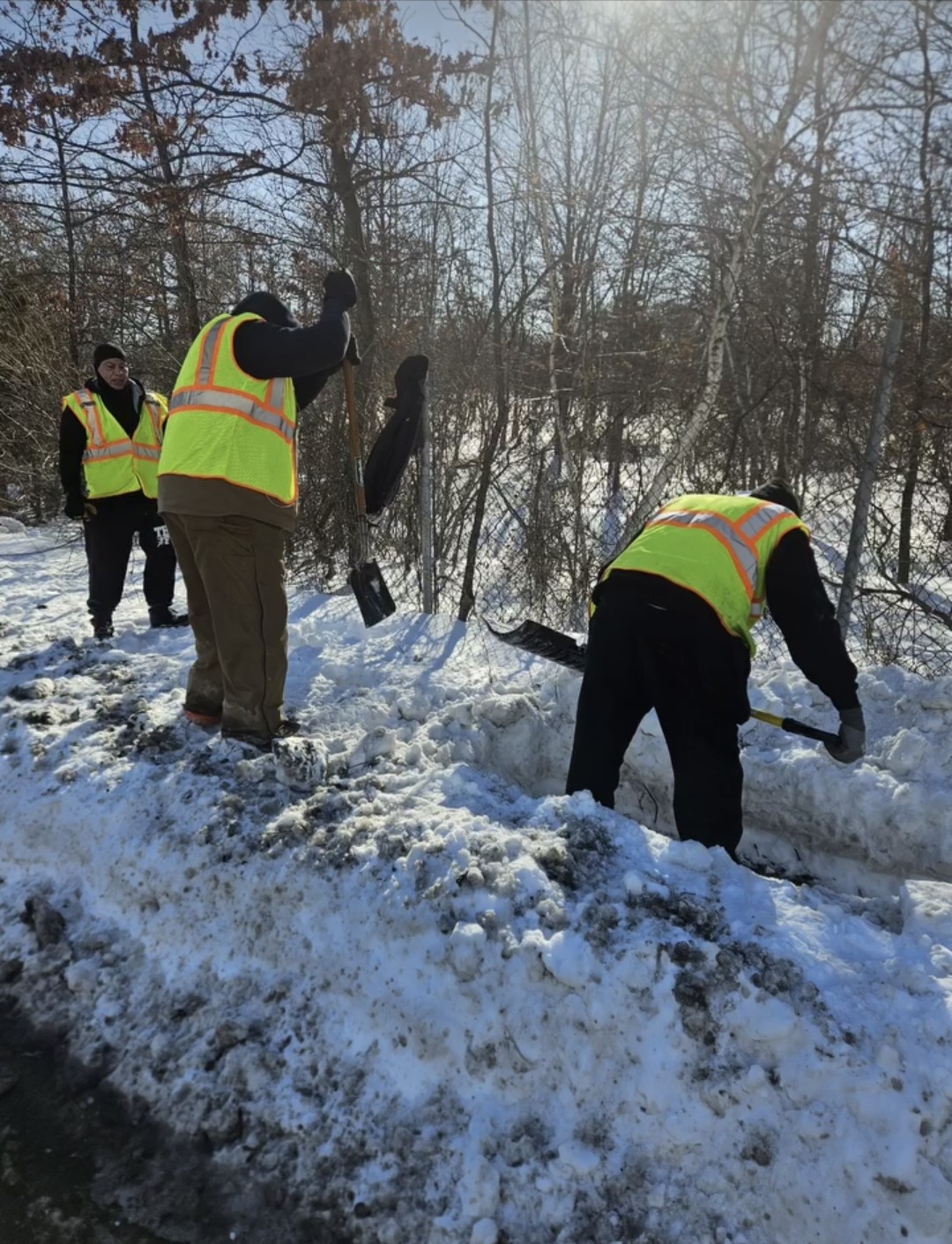 Crew clearing snow on a roadside